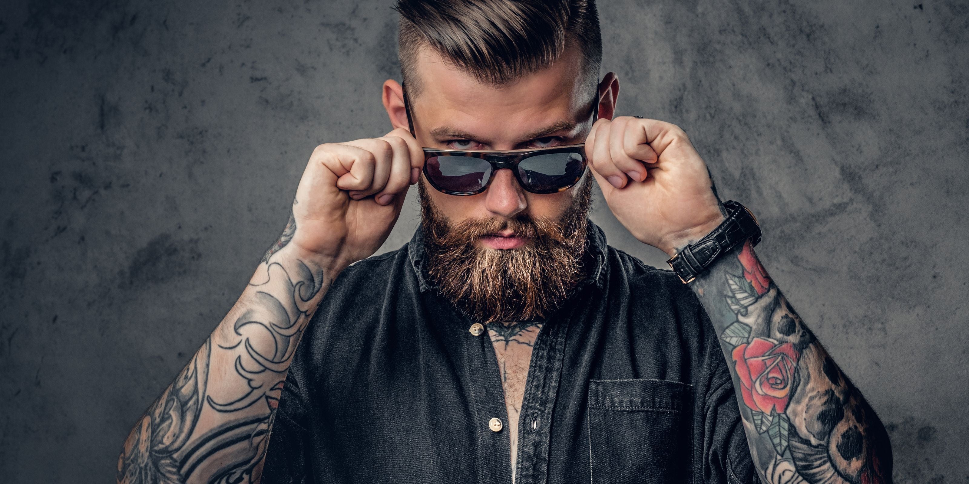 Man wearing a PUNCH watch with sunglasses, stylish timepiece paired with modern men’s fashion accessories