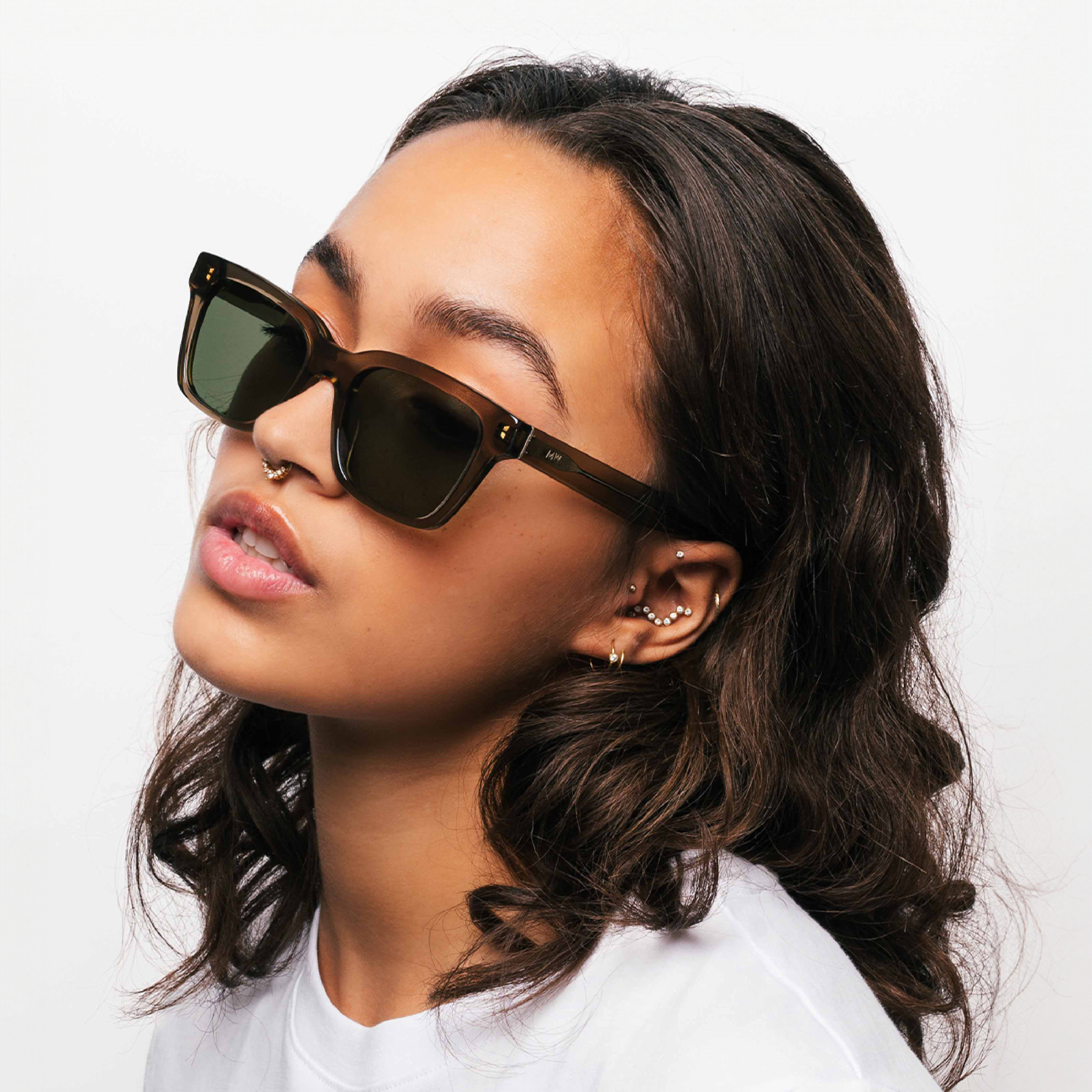 model wearing rectangular Messy Weekend Dean Sunglasses in Green
