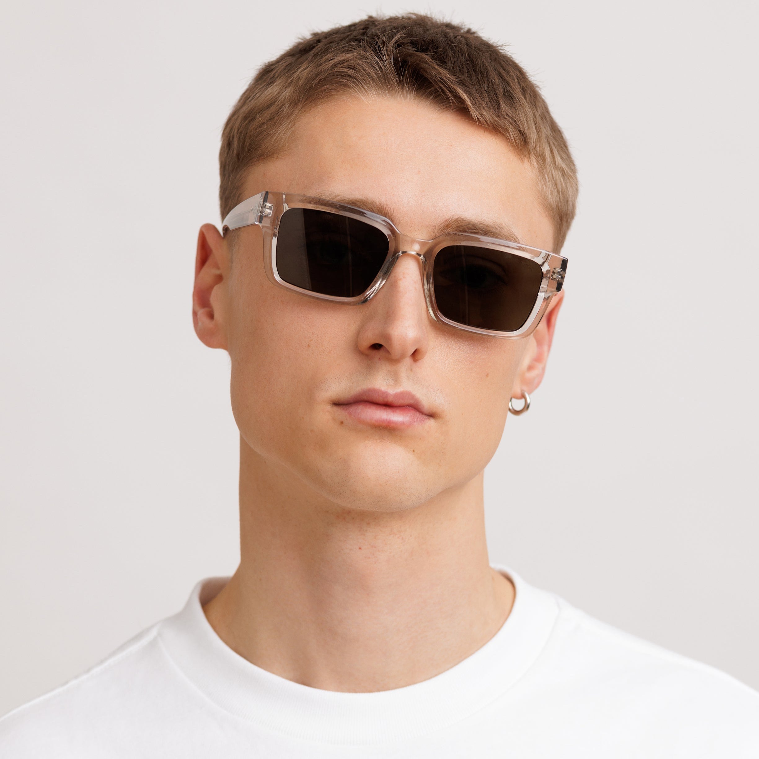 Man wearing Crystal frame rectangle sunglasses